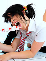 British girl in schoolgirl uniform sucking on more than a lolly